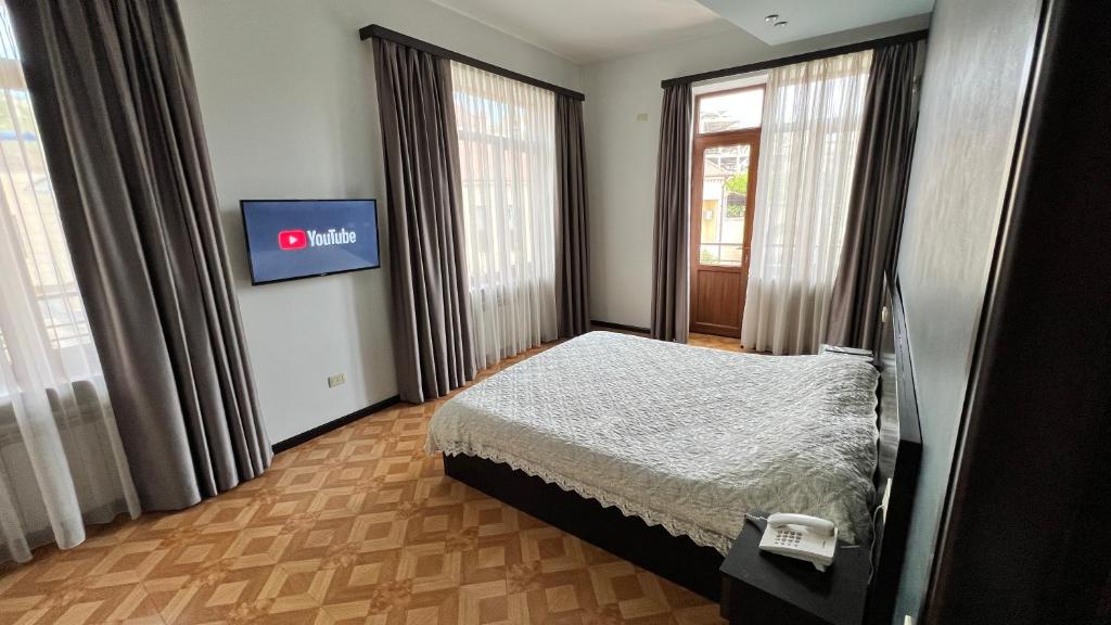 Postel nebo postele na pokoji v ubytování Grand Hills