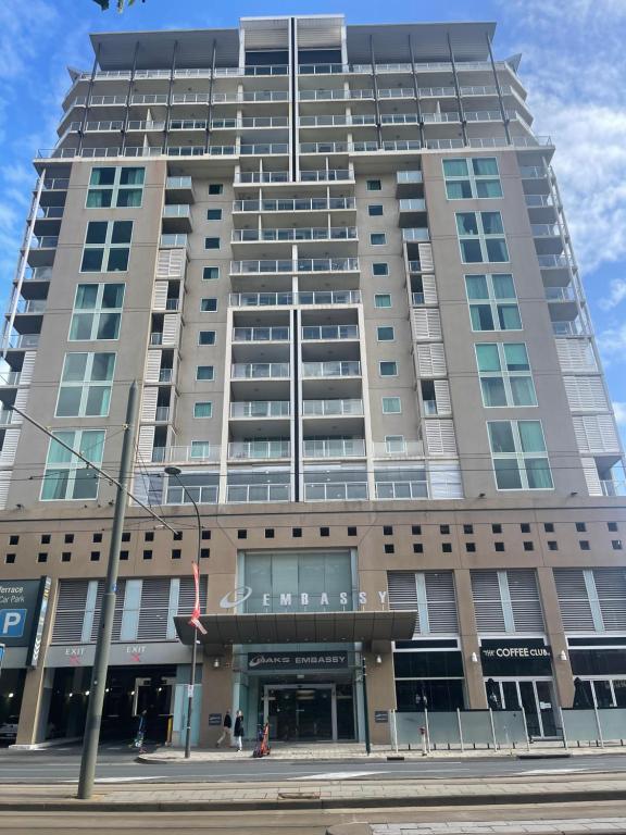 a large building on a city street with at Embassy 812 free parking in Adelaide