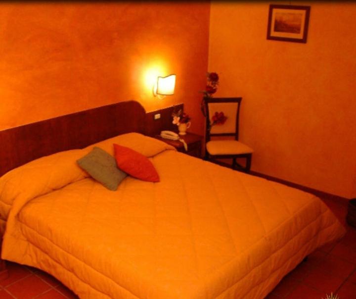 Postel nebo postele na pokoji v ubytování Hotel Natros