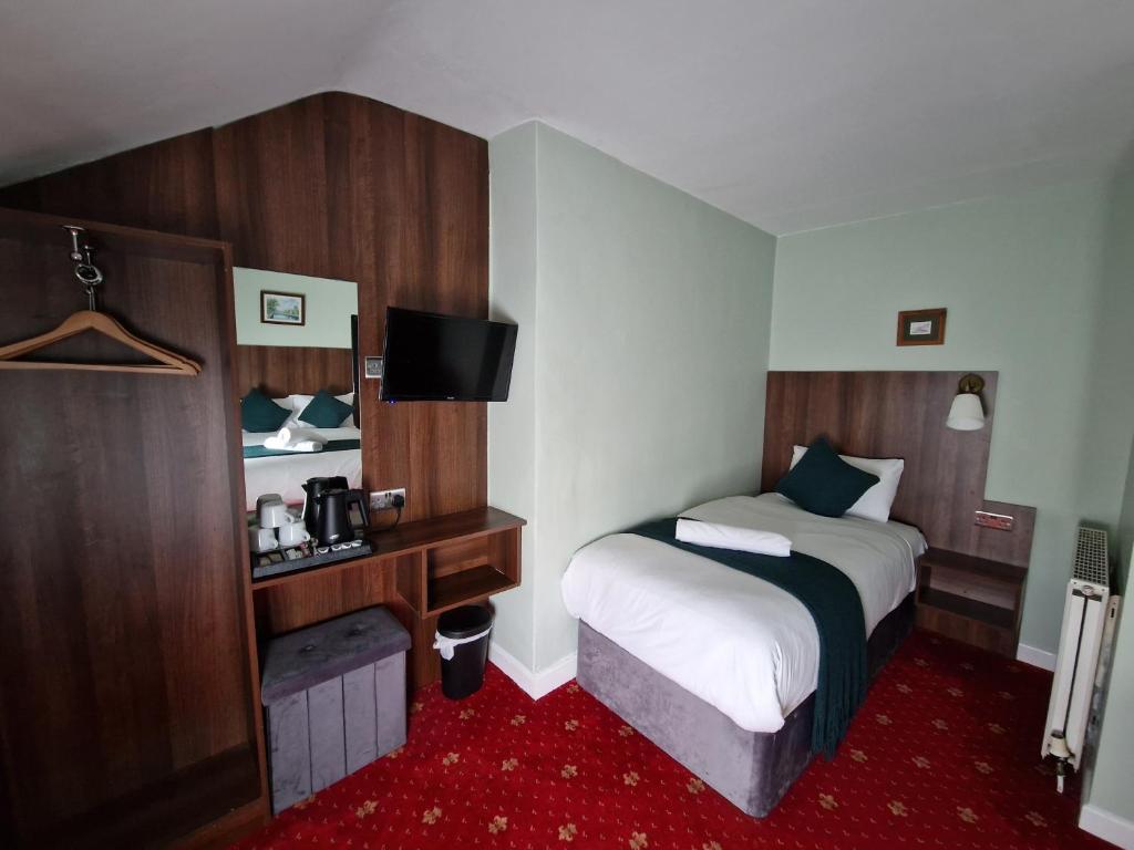 Postel nebo postele na pokoji v ubytování Lyndon Guesthouse