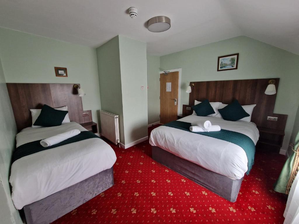 Postel nebo postele na pokoji v ubytování Lyndon Guesthouse