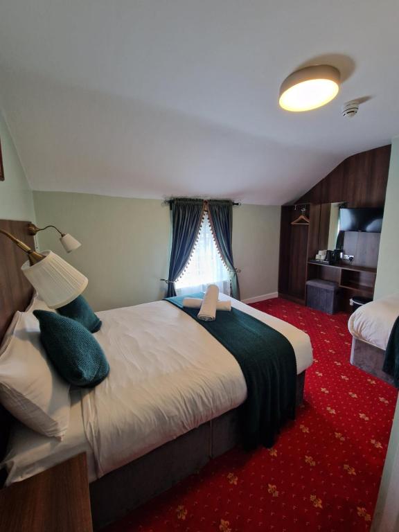 Postel nebo postele na pokoji v ubytování Lyndon Guesthouse