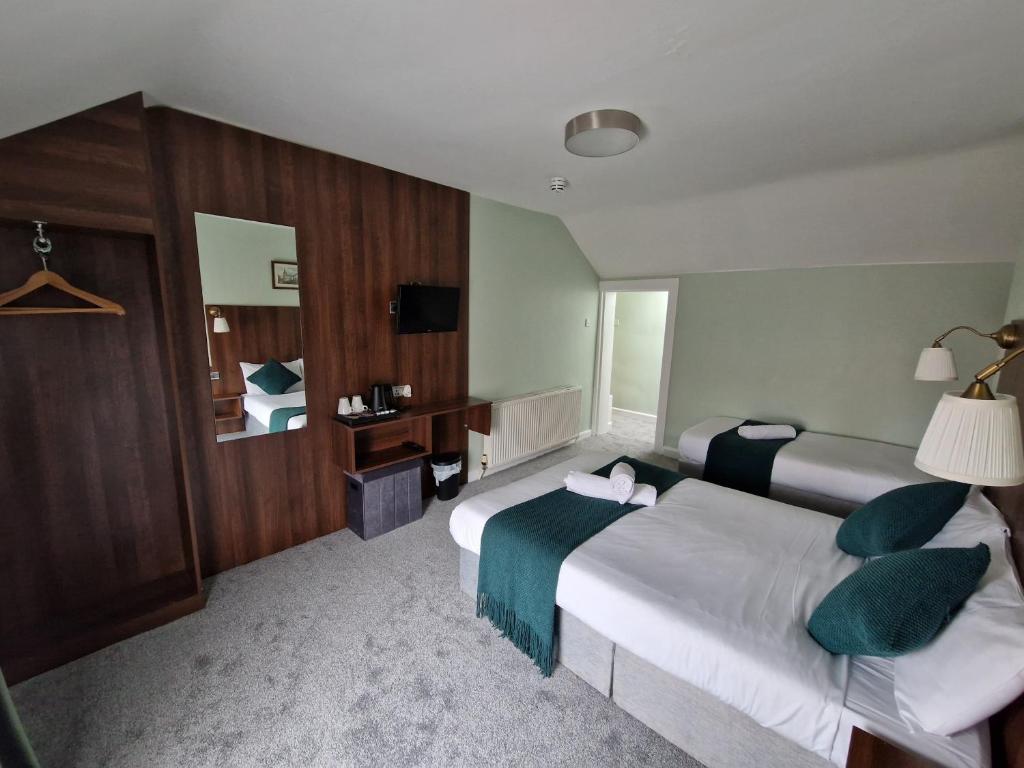 Postel nebo postele na pokoji v ubytování Lyndon Guesthouse