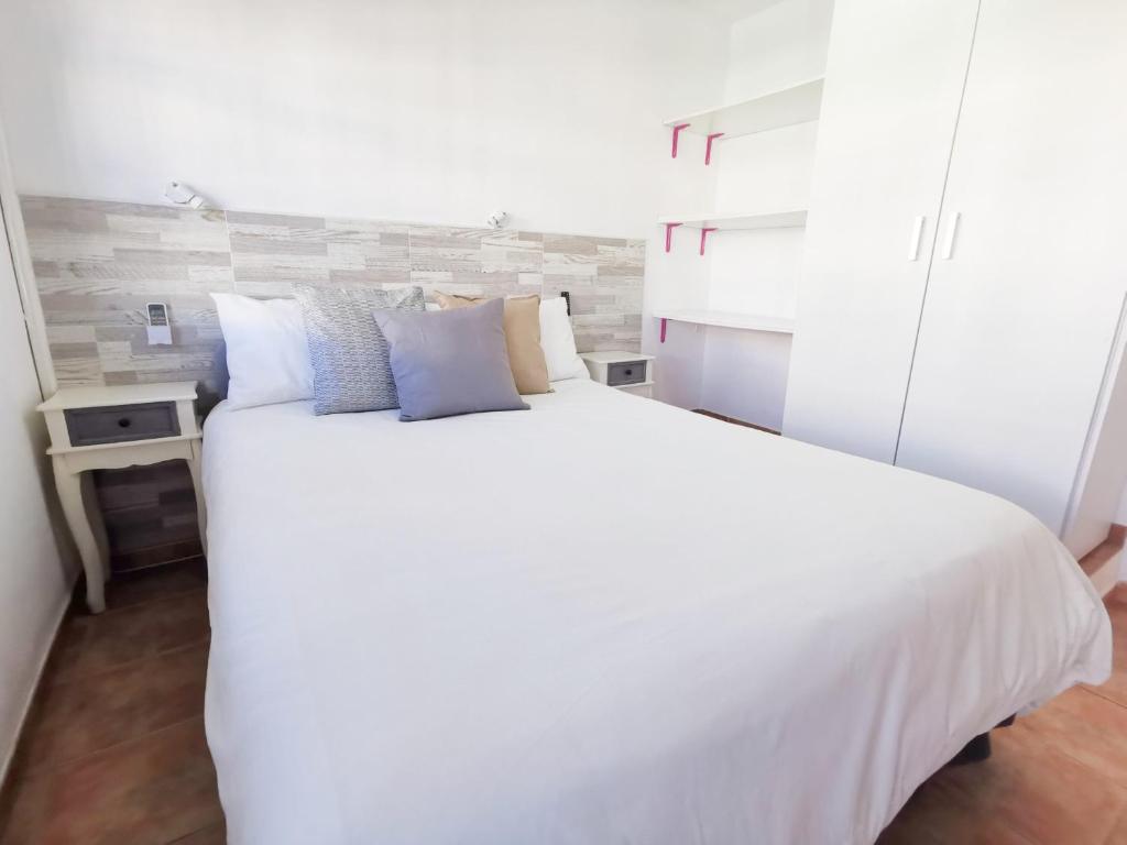 Postel nebo postele na pokoji v ubytování Bungalow Duna Verde