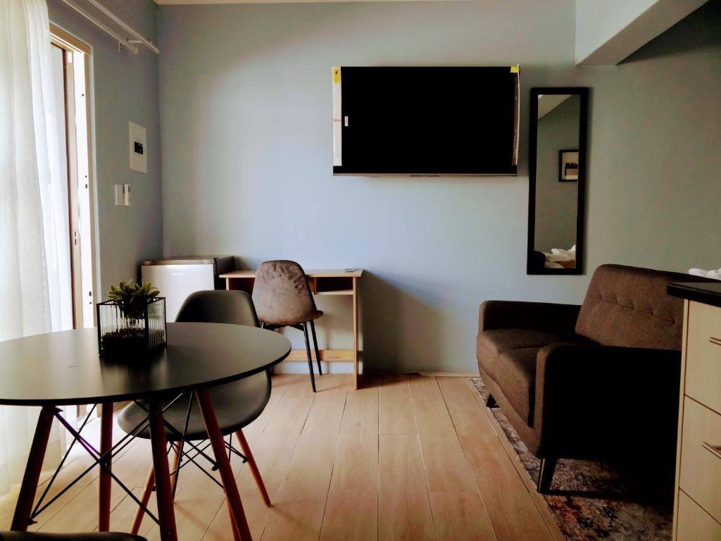 a living room with a couch and a table at 136 on 4th in Johannesburg