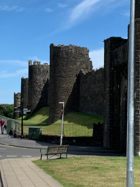 a bench sitting in front of a castle at 3 Newboro Terrace, Conwy in Conwy