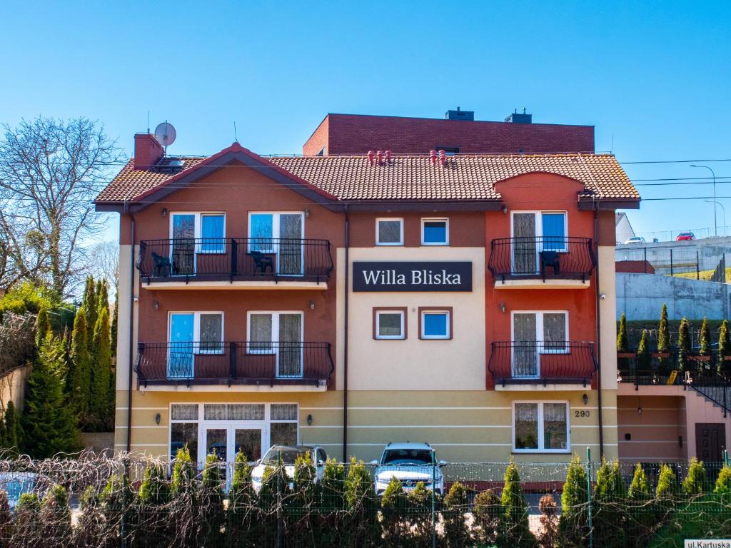 a building with a sign for a villa bristalis at Willa Bliska in Gdańsk