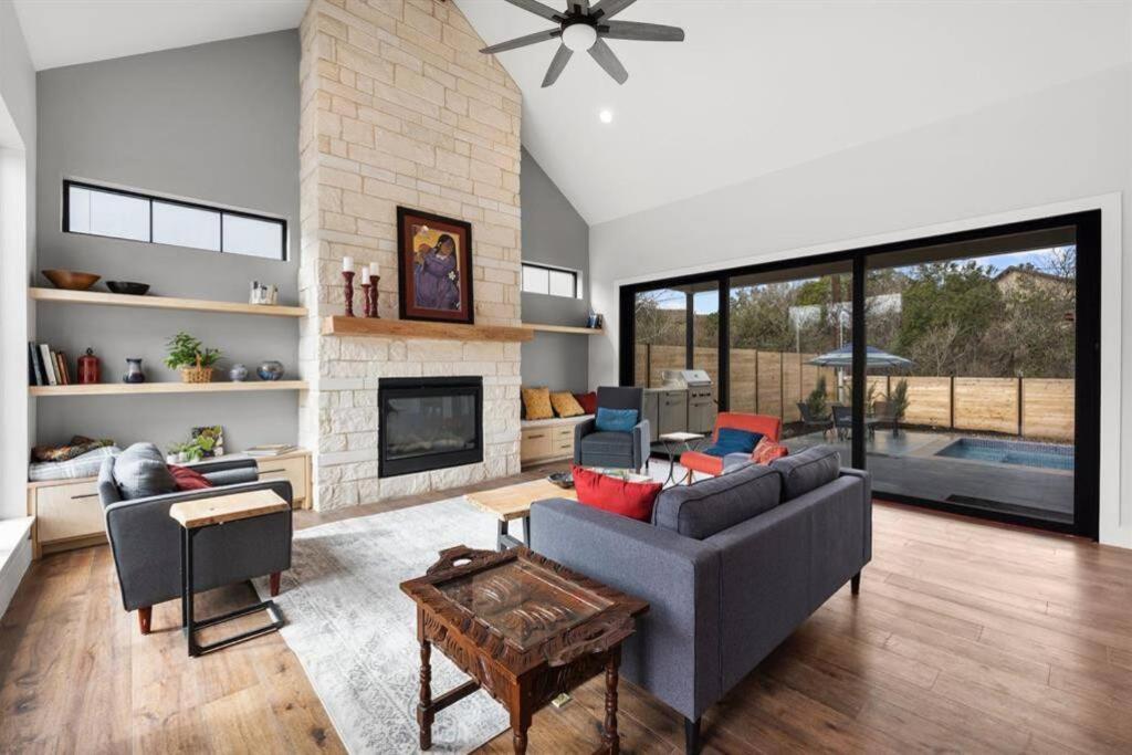 a living room with a couch and a fireplace at New House Cool Pool 4B/3.5B in south Austin in Austin