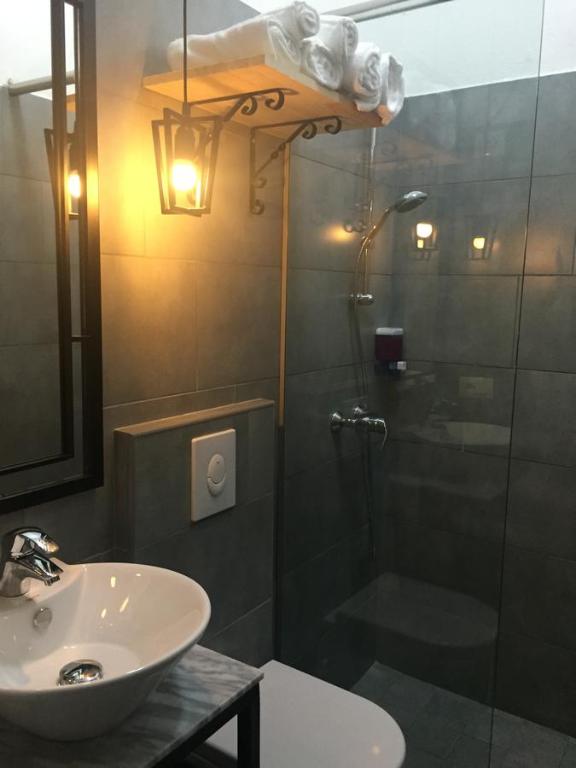 Koupelna v ubytování Hotel Antigone