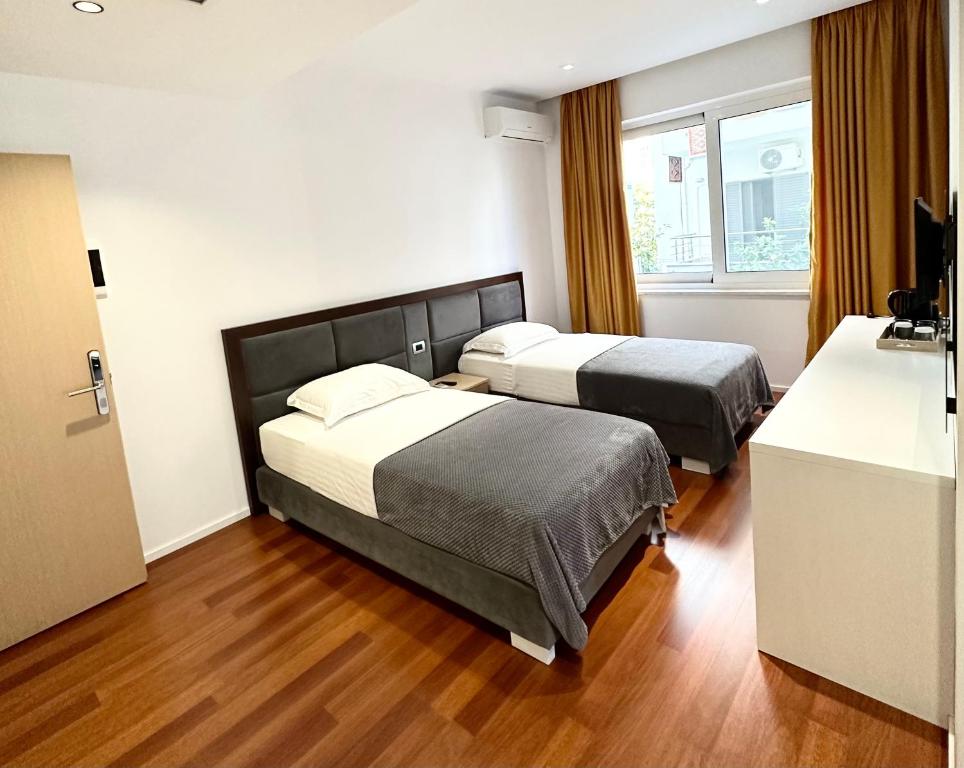 Postel nebo postele na pokoji v ubytování 3B Suites Boutique Hotel