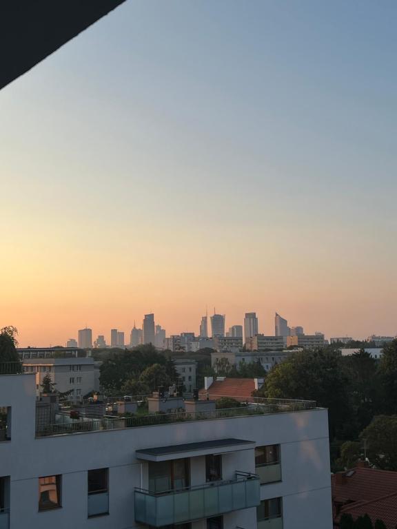a view of a city skyline at sunset at Apartament Księcia Janusza in Warsaw