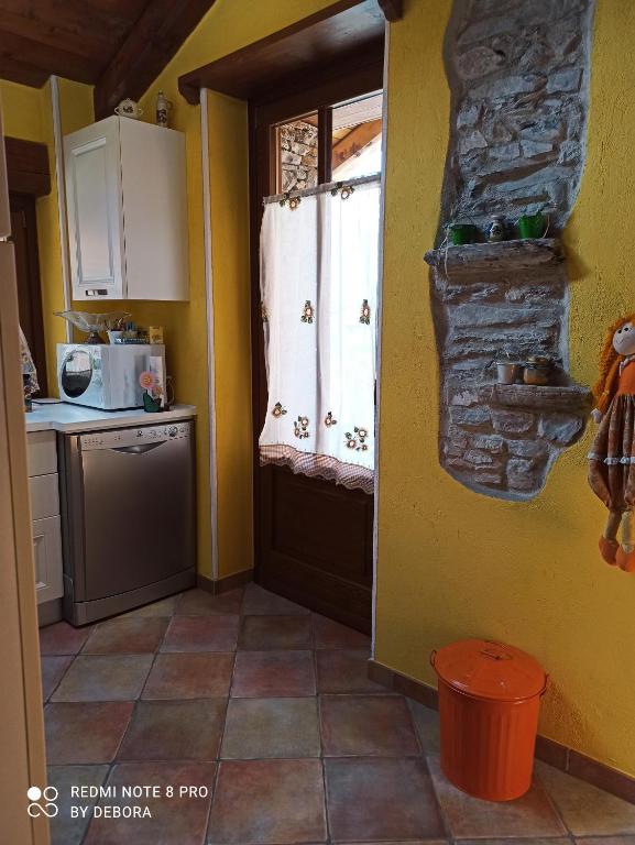 Kuchyň nebo kuchyňský kout v ubytování Casa Coccinella Valdieri
