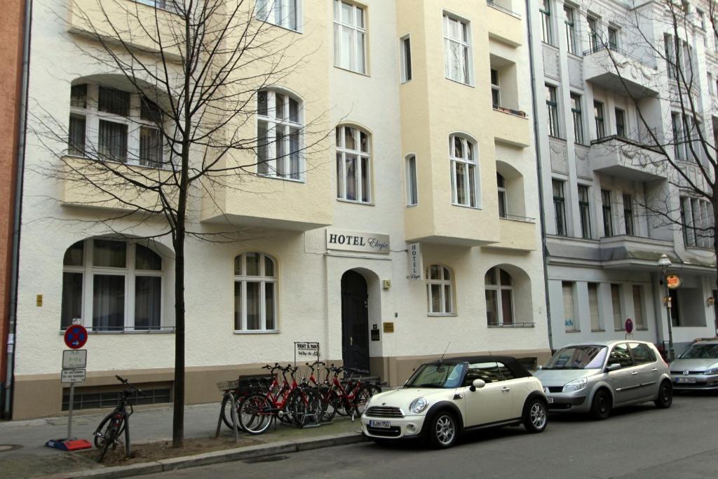 a white car parked in front of a building at Hotel Elegia am Kurfürstendamm in Berlin