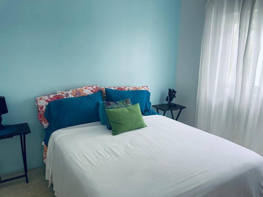 מיטה או מיטות בחדר ב-Casa de la Amor Casita