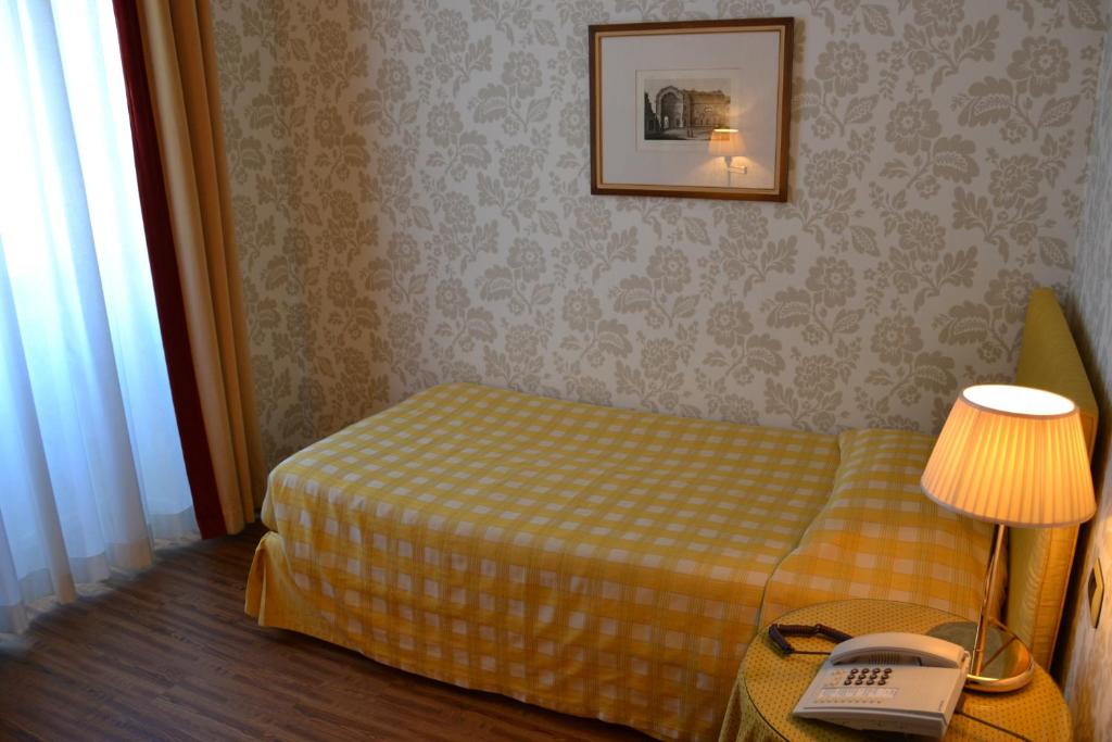 Postel nebo postele na pokoji v ubytování Albergo Alla Posta