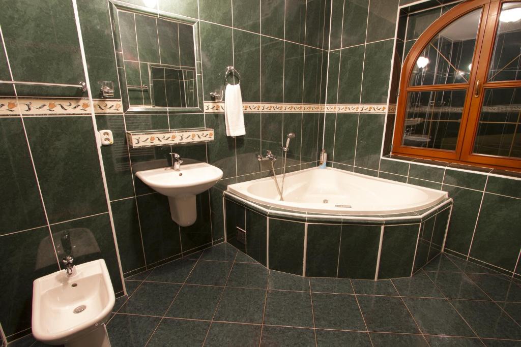 Koupelna v ubytování Hotel Grand