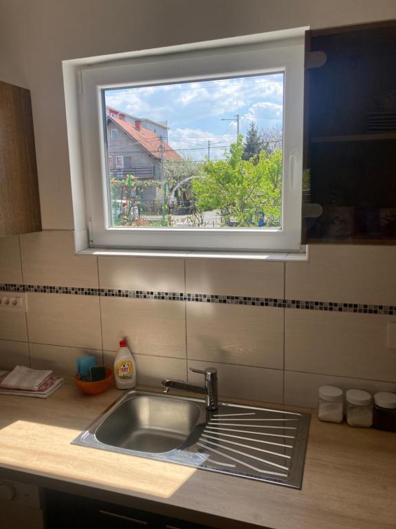 Kuchyň nebo kuchyňský kout v ubytování Apartment Milos