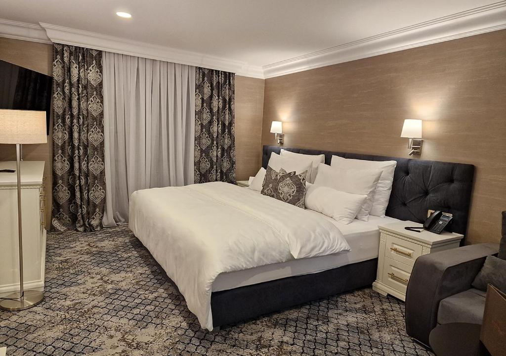 Posteľ alebo postele v izbe v ubytovaní Boutique Hotel Bora & Villas Garamm
