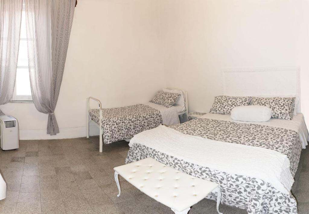 Postel nebo postele na pokoji v ubytování Palazzo Nari