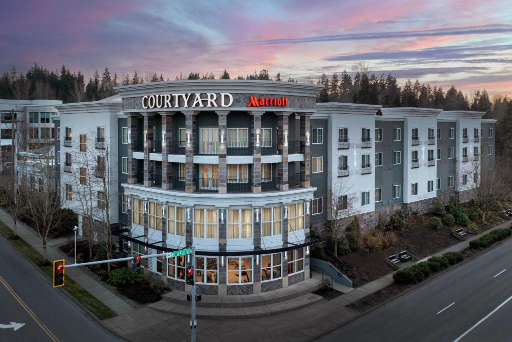 an aerial view of a building with a sign on it at Courtyard by Marriott Seattle Kirkland in Kirkland