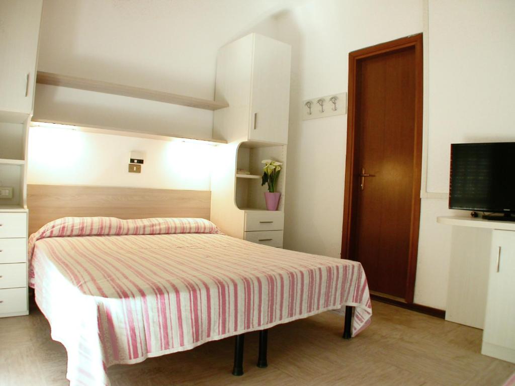 Postel nebo postele na pokoji v ubytování Albergo Aquila