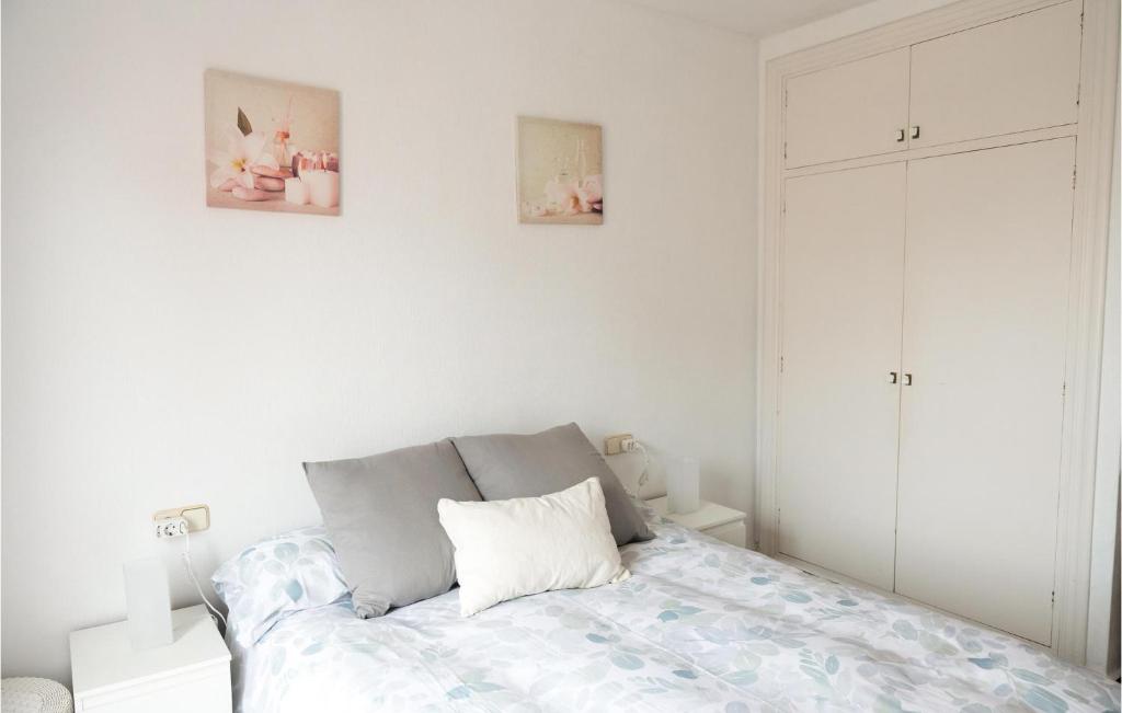 A bed or beds in a room at Nice Apartment In La Manga With Wifi