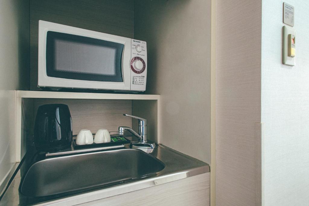 Kuchyň nebo kuchyňský kout v ubytování Hamilton Hotel Blue