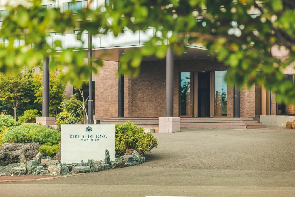 a building with a sign in front of it at Kiki Shiretoko Natural Resort in Shari