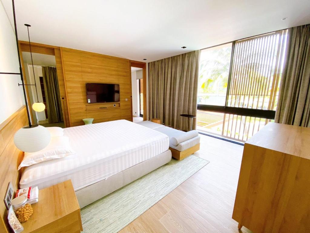 Postel nebo postele na pokoji v ubytování Phoenix Pool Villa Phu Quoc