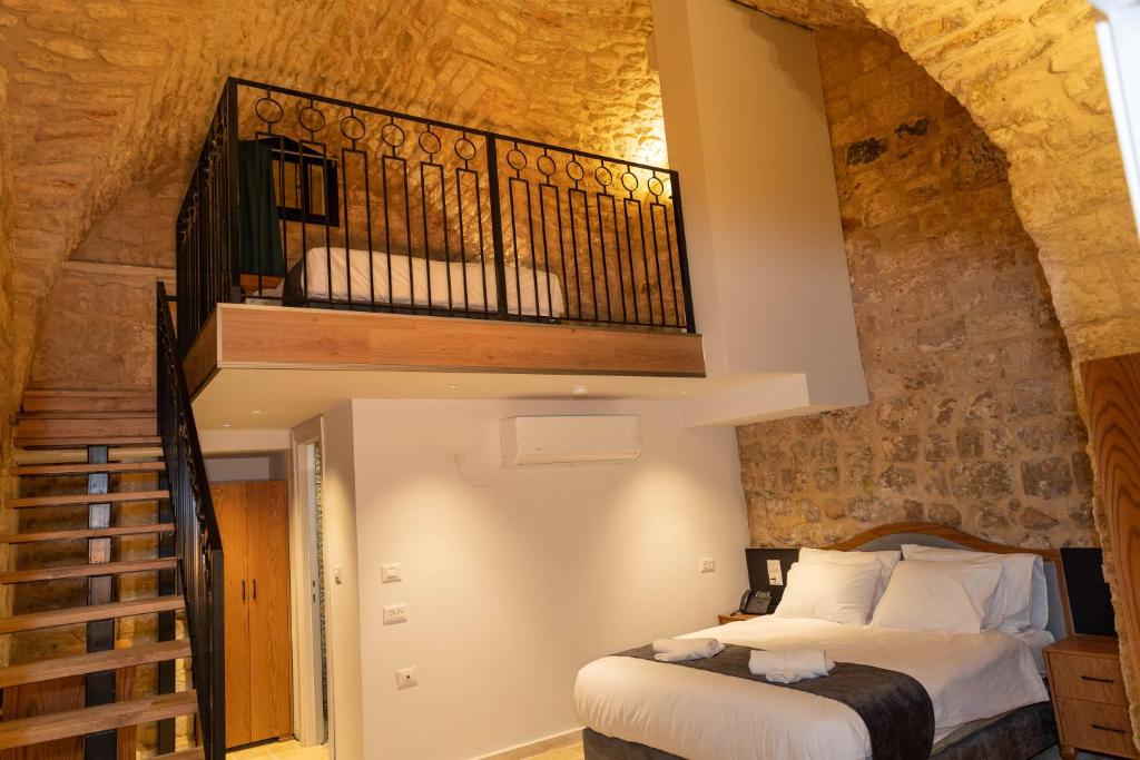 Postel nebo postele na pokoji v ubytování Saint Jacob Hotel