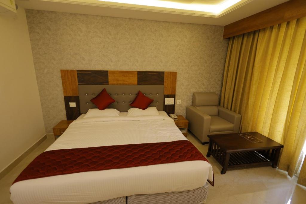 Postel nebo postele na pokoji v ubytování Hotel Woodside Prestige