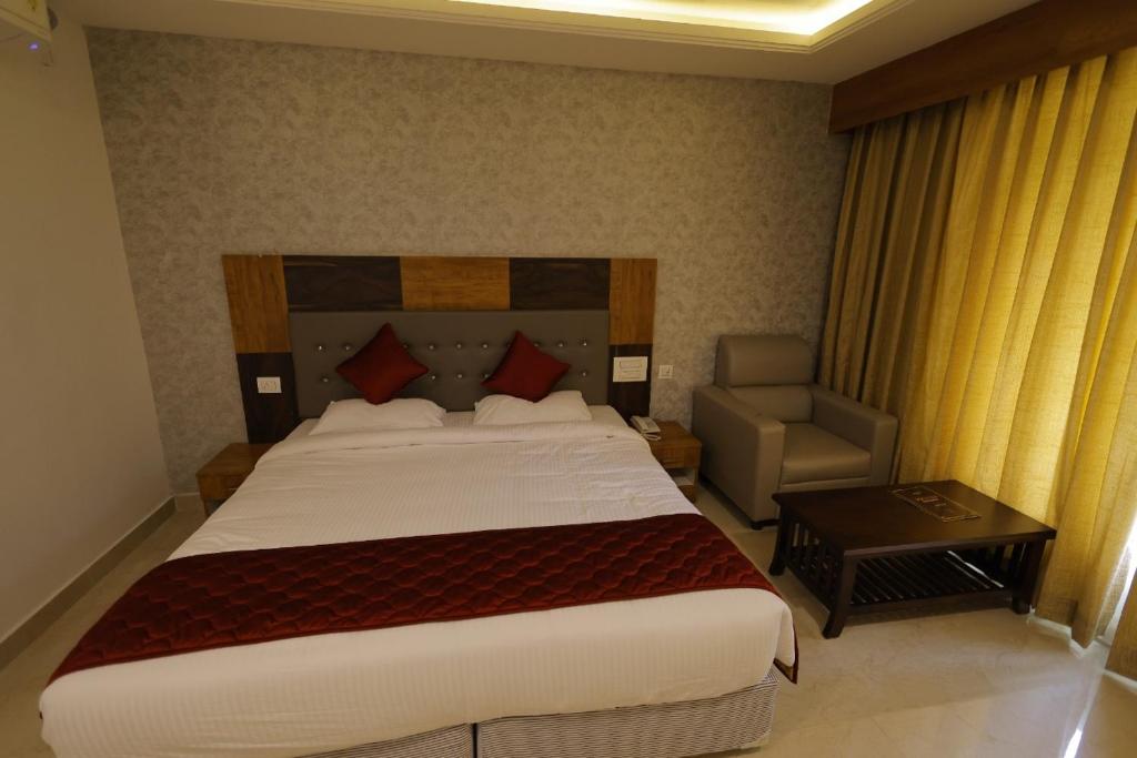 Postel nebo postele na pokoji v ubytování Hotel Woodside Prestige