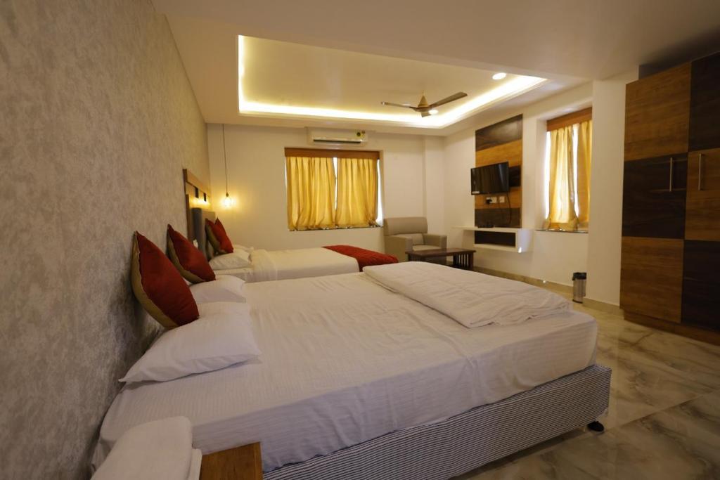 Postel nebo postele na pokoji v ubytování Hotel Woodside Prestige