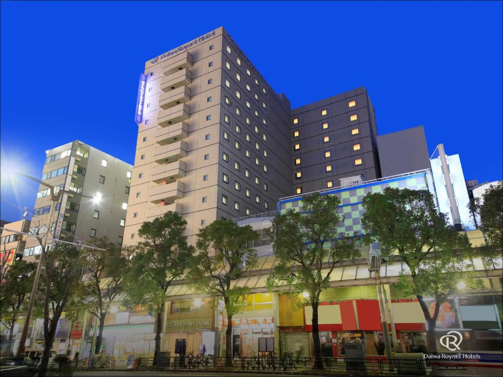 a tall building with trees in front of it at Daiwa Roynet Hotel Kawasaki in Kawasaki