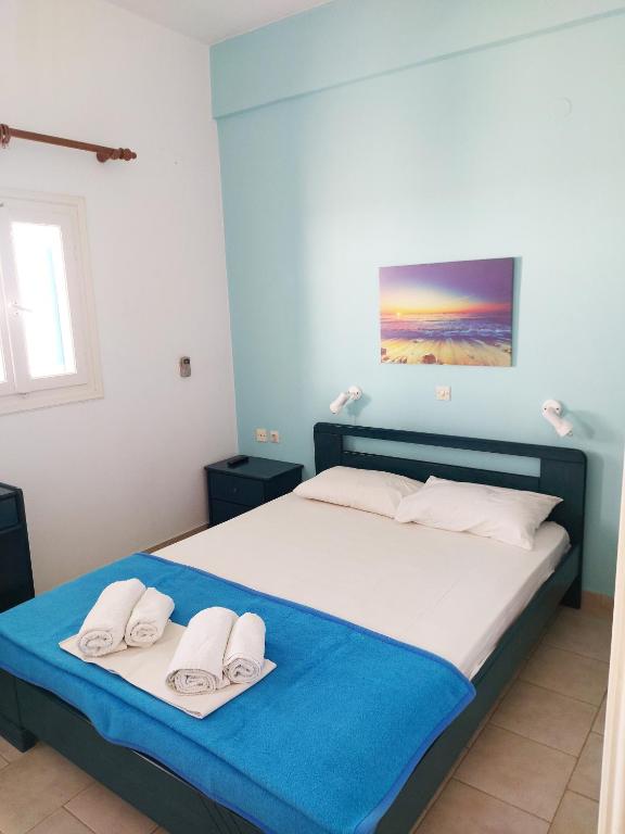 Postel nebo postele na pokoji v ubytování Aigaio View Studios & Rooms