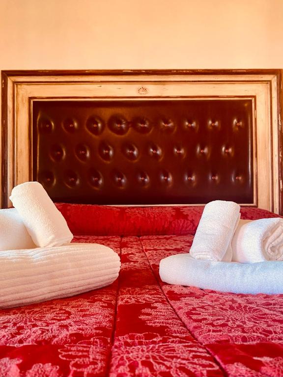 Postel nebo postele na pokoji v ubytování Poggio dei cavalieri