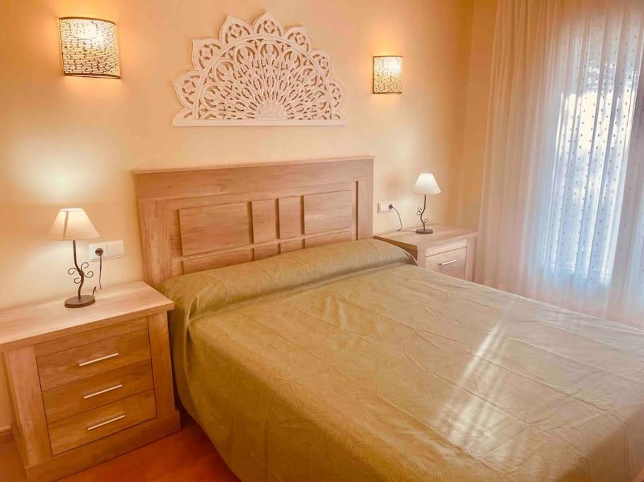 Posteľ alebo postele v izbe v ubytovaní Apartamento en primera línea de playa