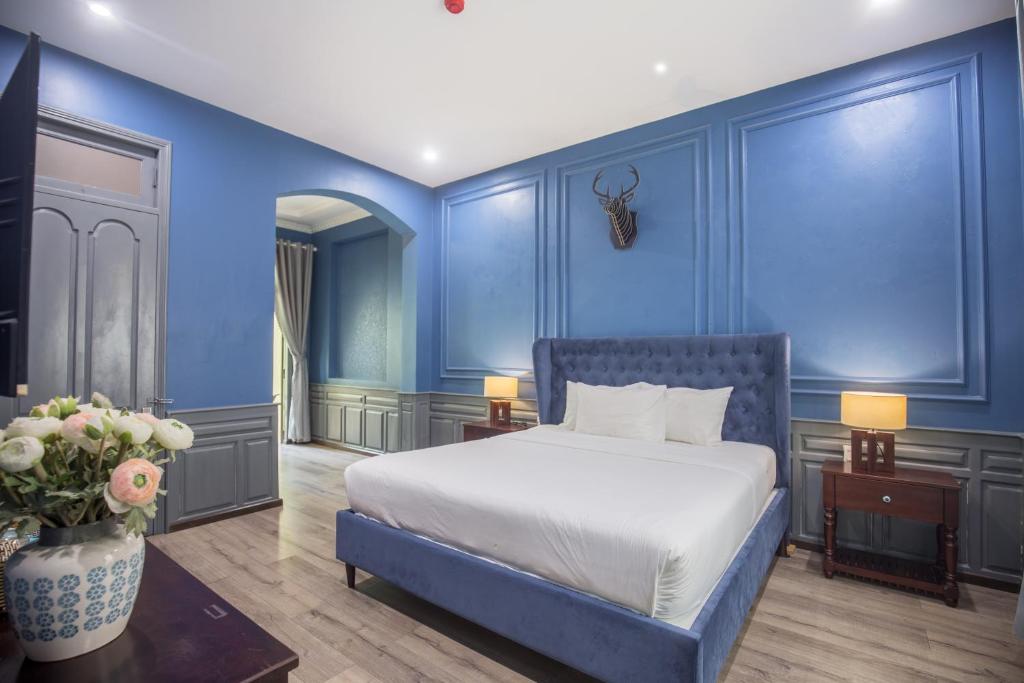 Giường trong phòng chung tại Thi Boutique Villa