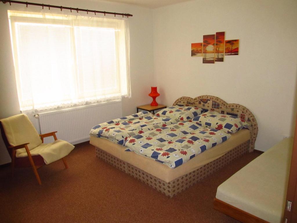Postel nebo postele na pokoji v ubytování Holiday Home U Čápů