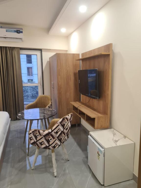 TV a/nebo společenská místnost v ubytování Amahi Inn - Sector 48