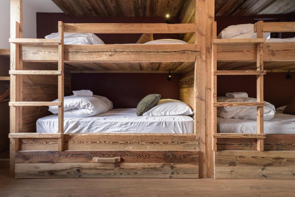 Postel nebo postele na pokoji v ubytování Hôtel Maison Doron