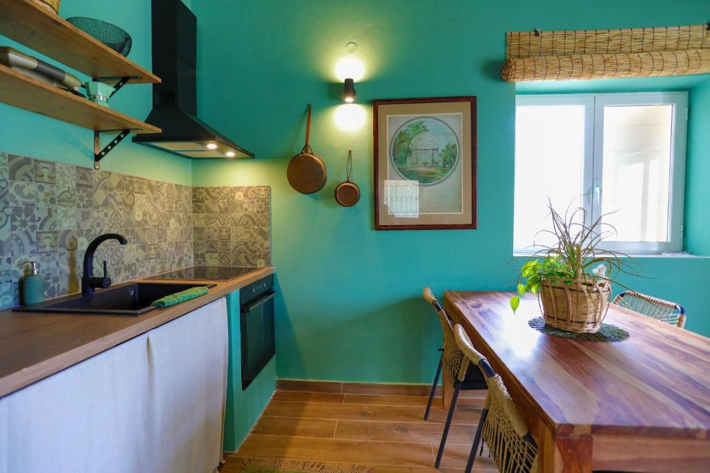 Kuchyň nebo kuchyňský kout v ubytování Fede - Danilia Cottages