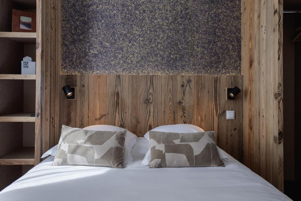 Postel nebo postele na pokoji v ubytování Hôtel Maison Doron