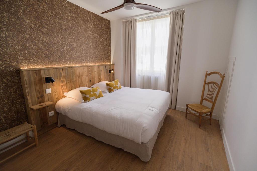 Postel nebo postele na pokoji v ubytování Hôtel Maison Doron