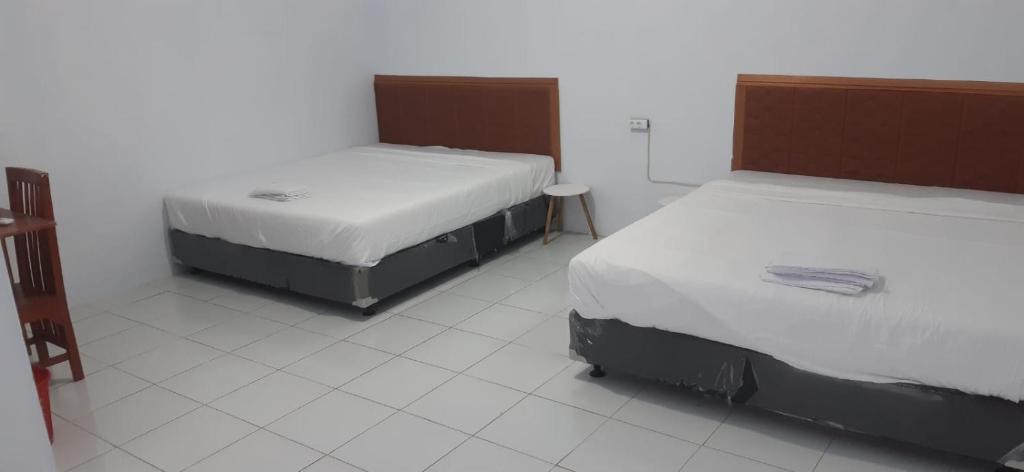 Postel nebo postele na pokoji v ubytování Lejo Grand Hotel