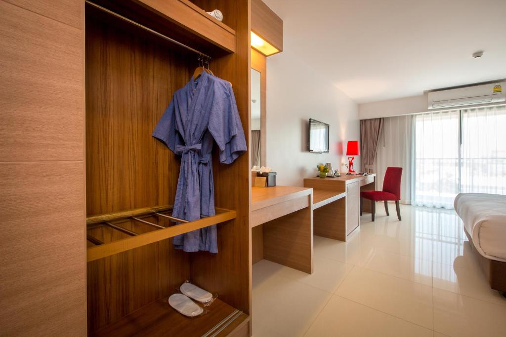 Postel nebo postele na pokoji v ubytování Riche Hua Hin Hotel - SHA Plus