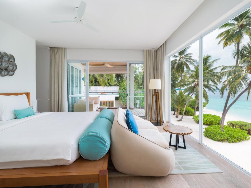 Postel nebo postele na pokoji v ubytování Amilla Maldives