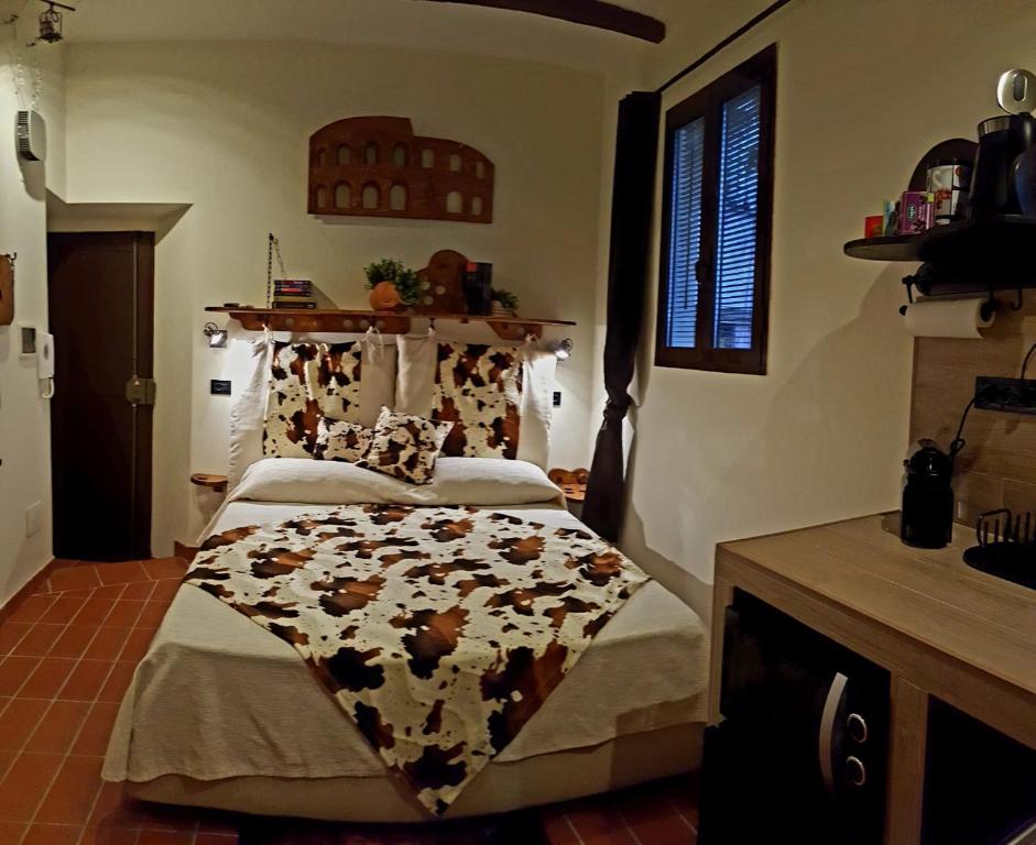 a bedroom with a bed with a cow blanket on it at The Rabbit Hole in Rome