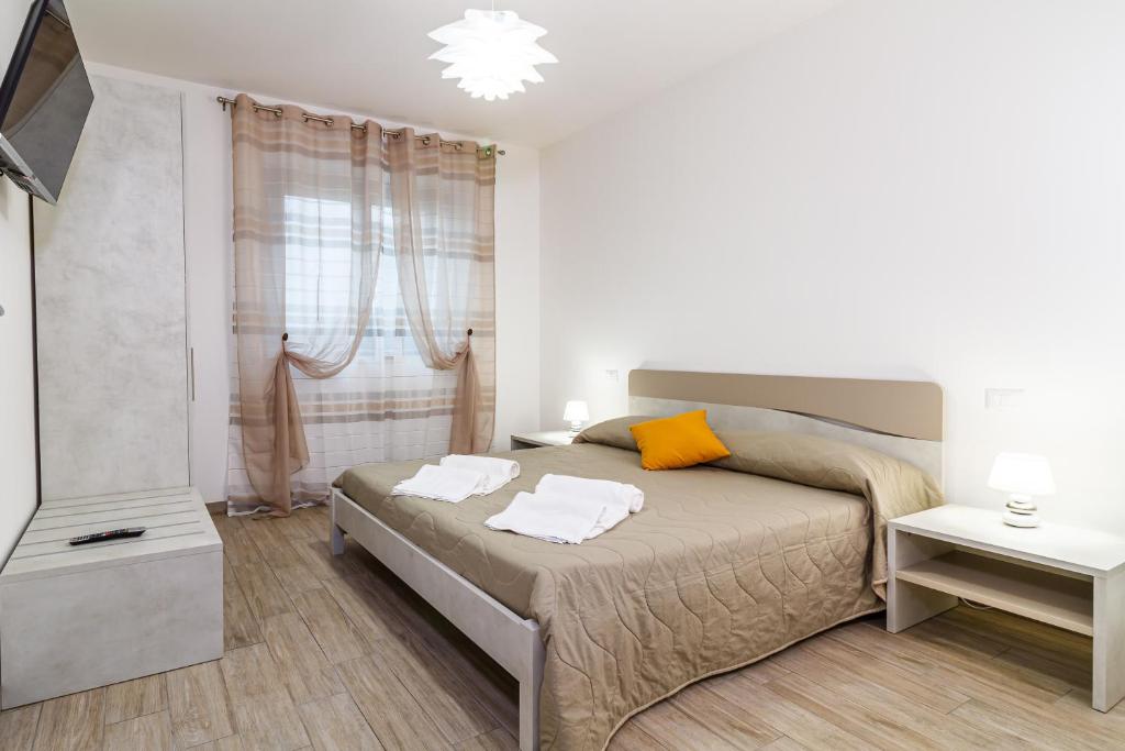 Postel nebo postele na pokoji v ubytování Agriturismo Fusini