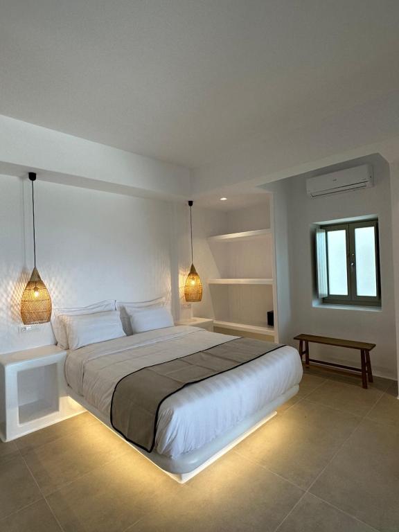 Posteľ alebo postele v izbe v ubytovaní Quattro Venti Suites Mykonos